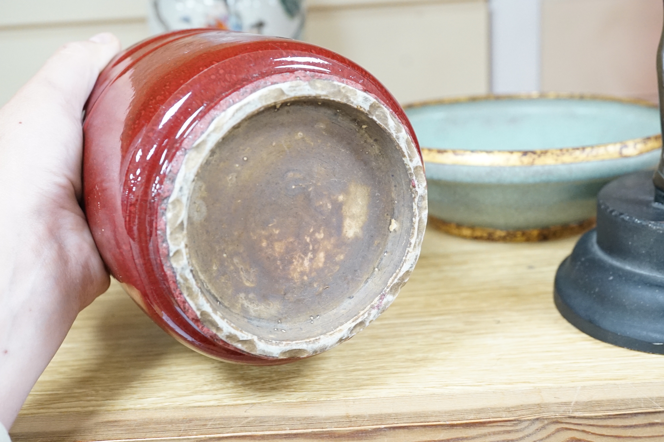 A Chinese famille rose vase, a crackle glaze vase and a sang de boeuf jar, tallest 21.5cm